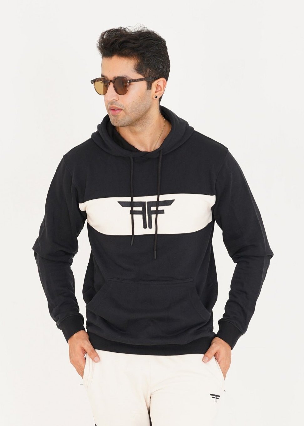 Man wearing black and off white hoodie by Ftero Fit