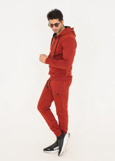 Man wearing fire brick orange fleece tracksuit by Ftero Fit